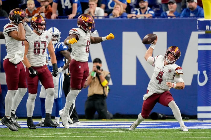 Washington Commanders quarterback Taylor Heinicke (4) spikes the ball after a game-tying touchdown Sunday, Oct. 30, 2022, during a game against the Indianapolis Colts at Indianapolis Colts at Lucas Oil.